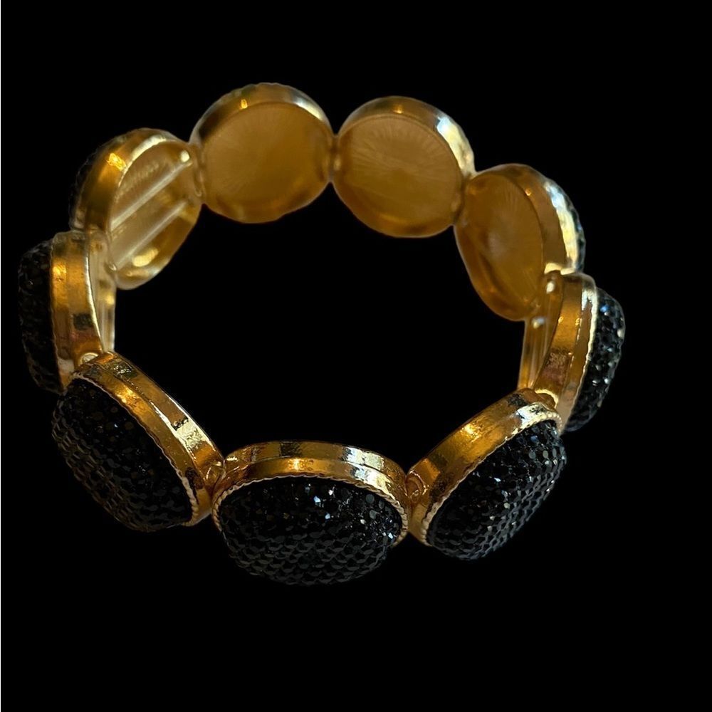 Gold bracelet with a black rhinestones